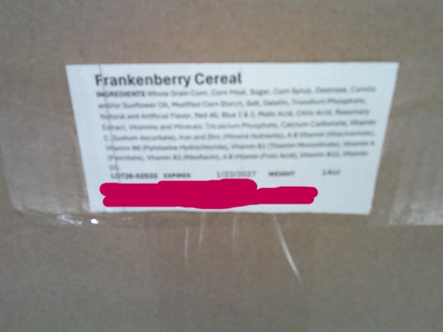 Franken berry label taped on a cardboard box.